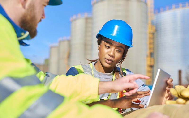 California public works construction workers with laptop public works